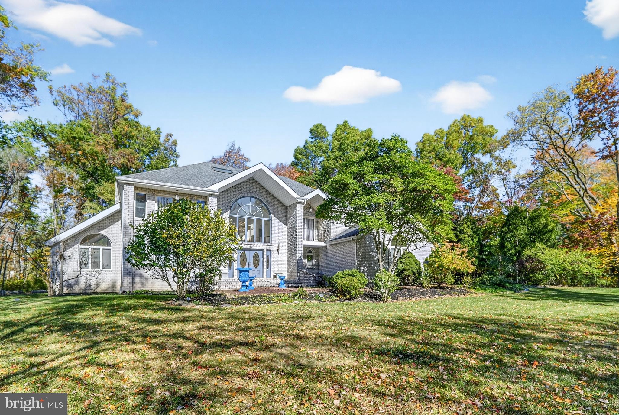 16 Benedek Road Princeton, NJ 08540 - Photo 3 of 60 a front view of a house with a garden