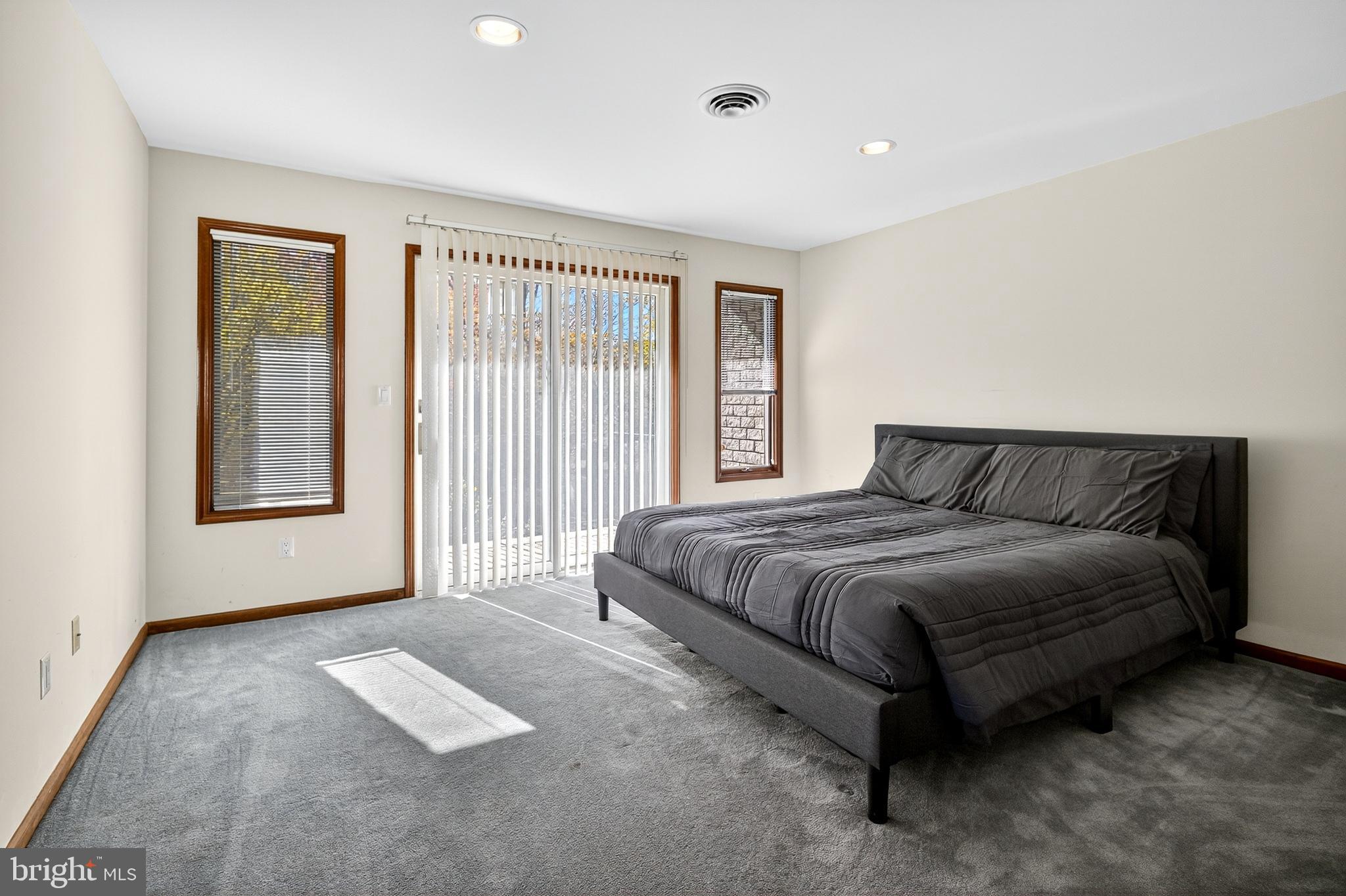 16 Benedek Road Princeton, NJ 08540 - Photo 38 of 60 a spacious bedroom with a bed and glass window