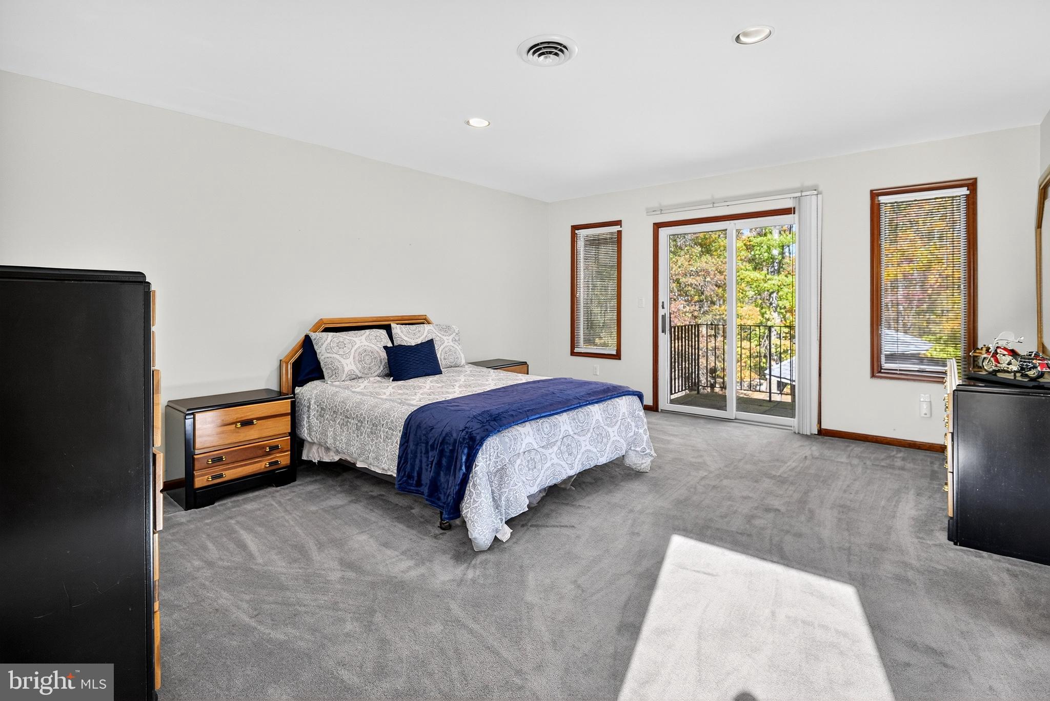 16 Benedek Road Princeton, NJ 08540 - Photo 39 of 60 a spacious bedroom with a bed and a couch