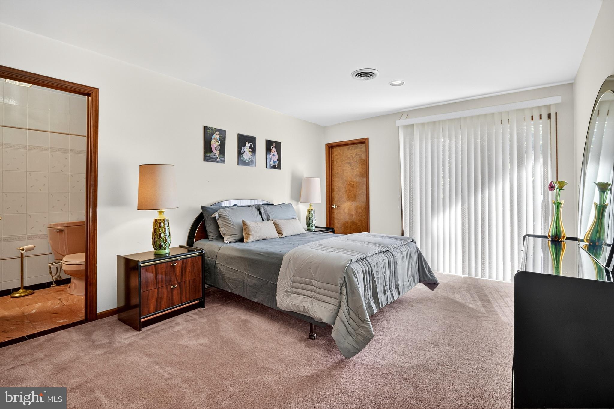 16 Benedek Road Princeton, NJ 08540 - Photo 42 of 60 a spacious bedroom with a bed and a couch