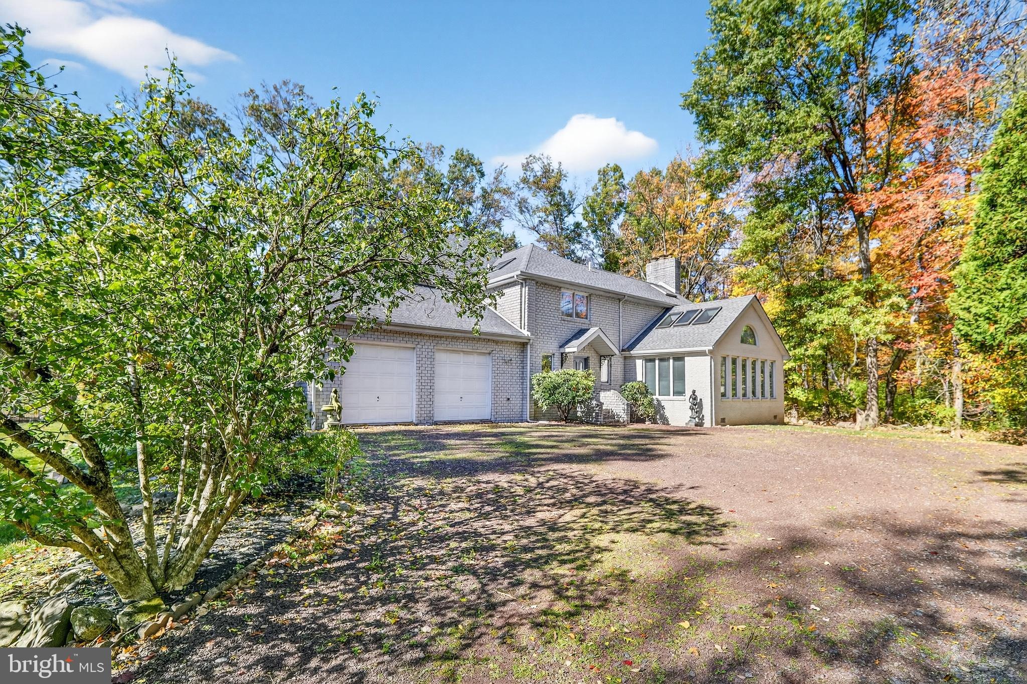 16 Benedek Road Princeton, NJ 08540 - Photo 47 of 60 front view of a house with a trees