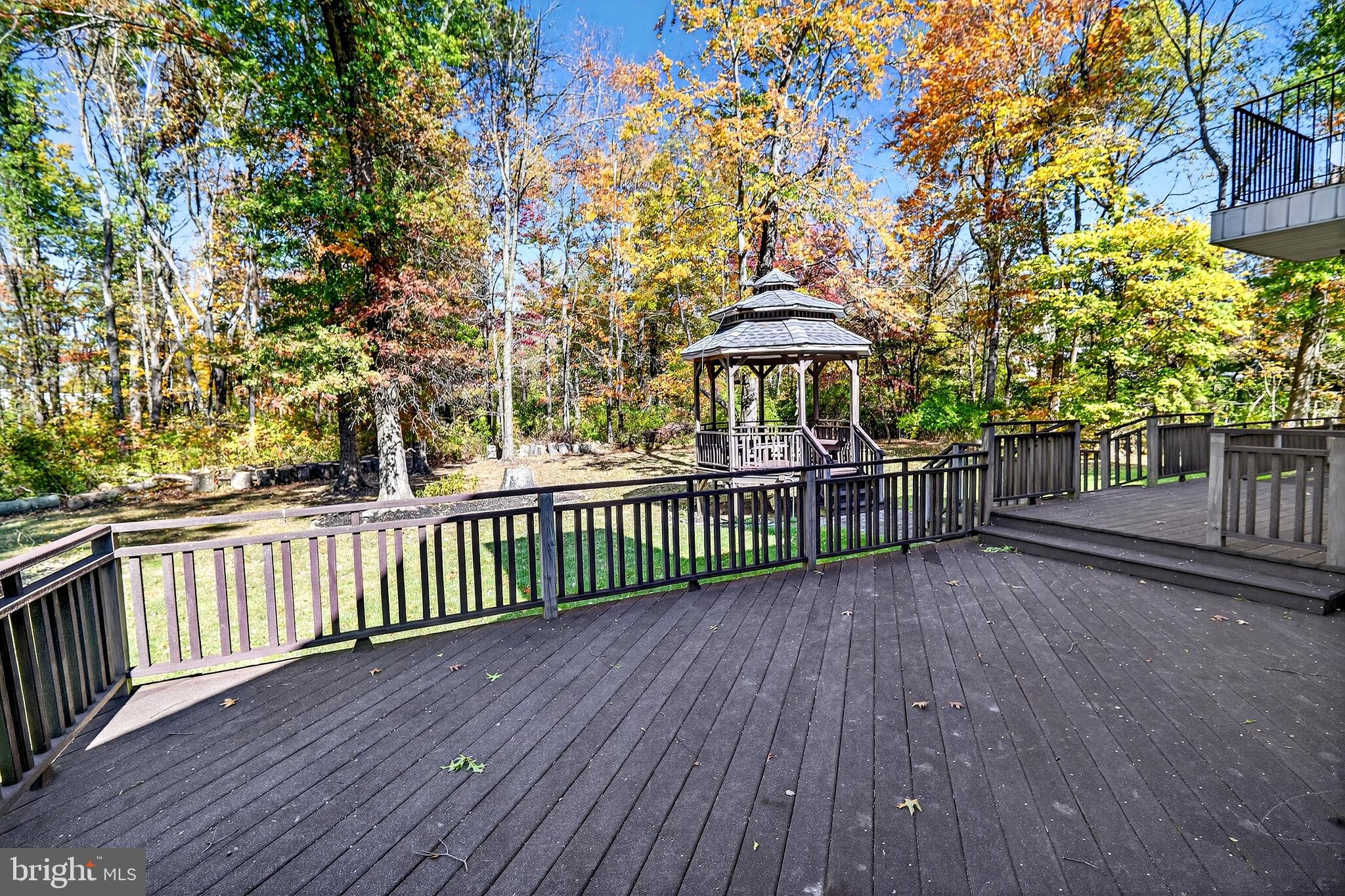 16 Benedek Road Princeton, NJ 08540 - Photo 48 of 60 a view of a wooden fence and a bench