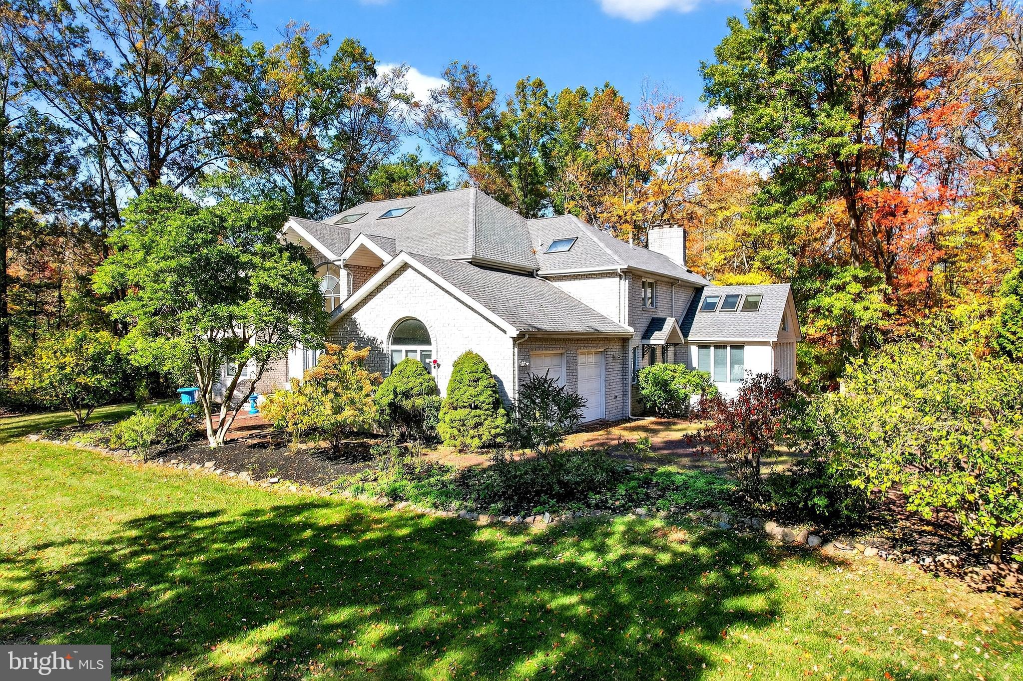 16 Benedek Road Princeton, NJ 08540 - Photo 50 of 60 a view of a house with a big yard and large trees