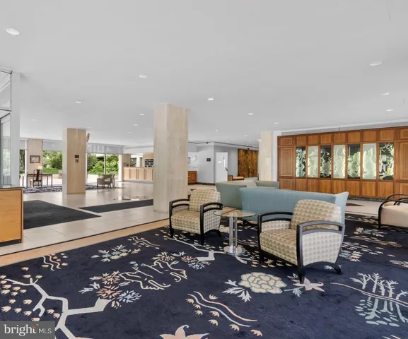 a living room with furniture and a rug