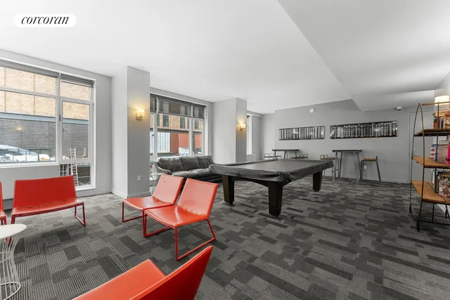 a living room with couches and potted plants