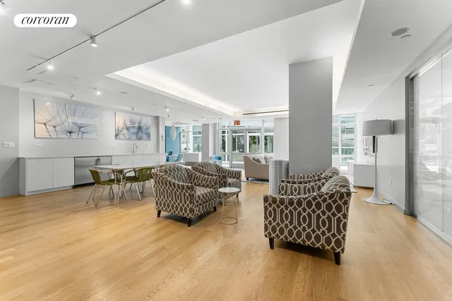 a dining room with furniture and wooden floor