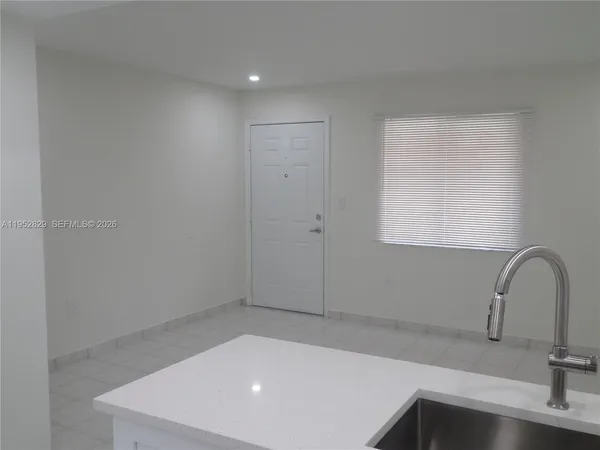 a bathroom with a sink and a window