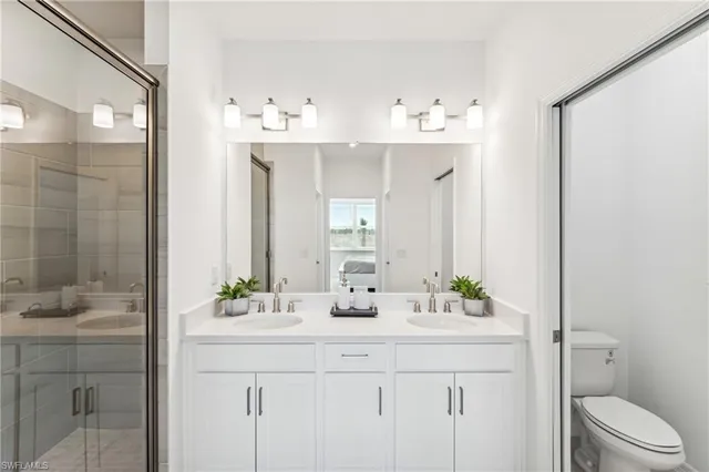 a bathroom with a sink double vanity and a mirror