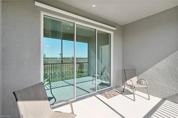a living room with a couch and large window
