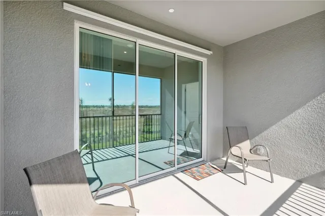 a living room with a couch and large window