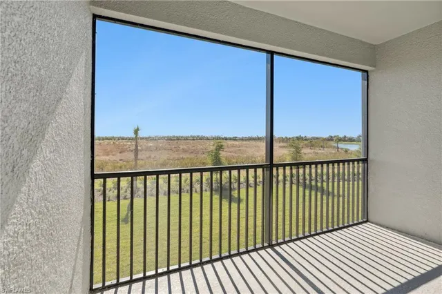 a view of a balcony with wooden floor