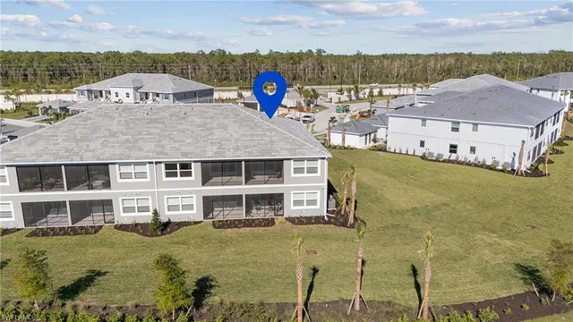 aerial view of a house with a yard