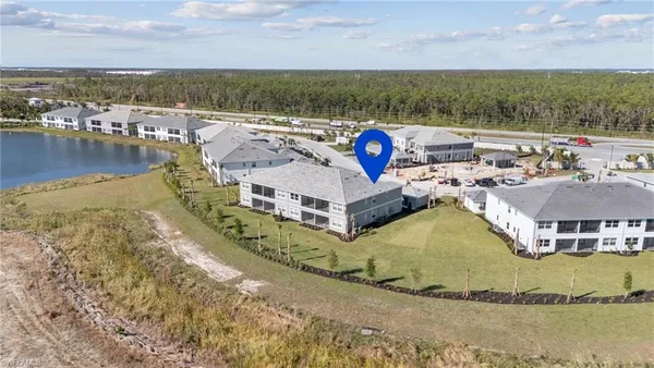 an aerial view of a house with a ocean view