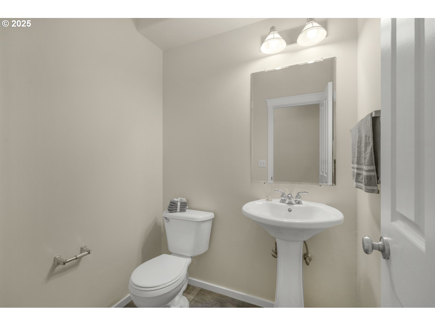 20591 Southwest Ravenswood Street Beaverton, OR 97078 - Photo 16 of 31 a bathroom with a sink mirror and toilet