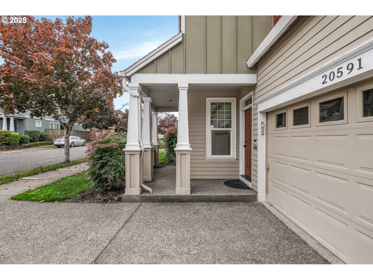 20591 Southwest Ravenswood Street Beaverton, OR 97078 - Photo 2 of 31 a view of a house with a garden