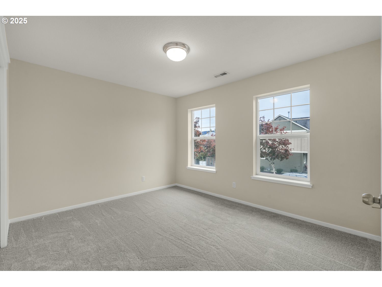 20591 Southwest Ravenswood Street Beaverton, OR 97078 - Photo 24 of 31 a view of an empty room with a window