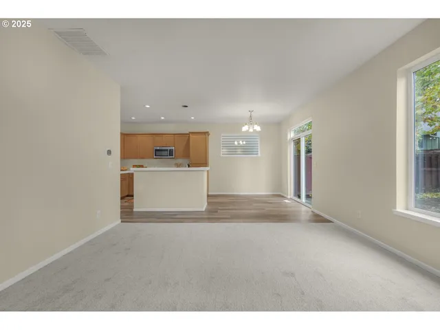 a view of a kitchen with a sink and a window