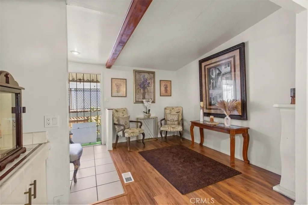 9080 Bloomfield Avenue, Unit 33 Cypress, CA 90630 - Photo 11 of 30 The dining and living room offer an open, inviting layout with abundant natural light, perfect for gatherings and everyday comfort.