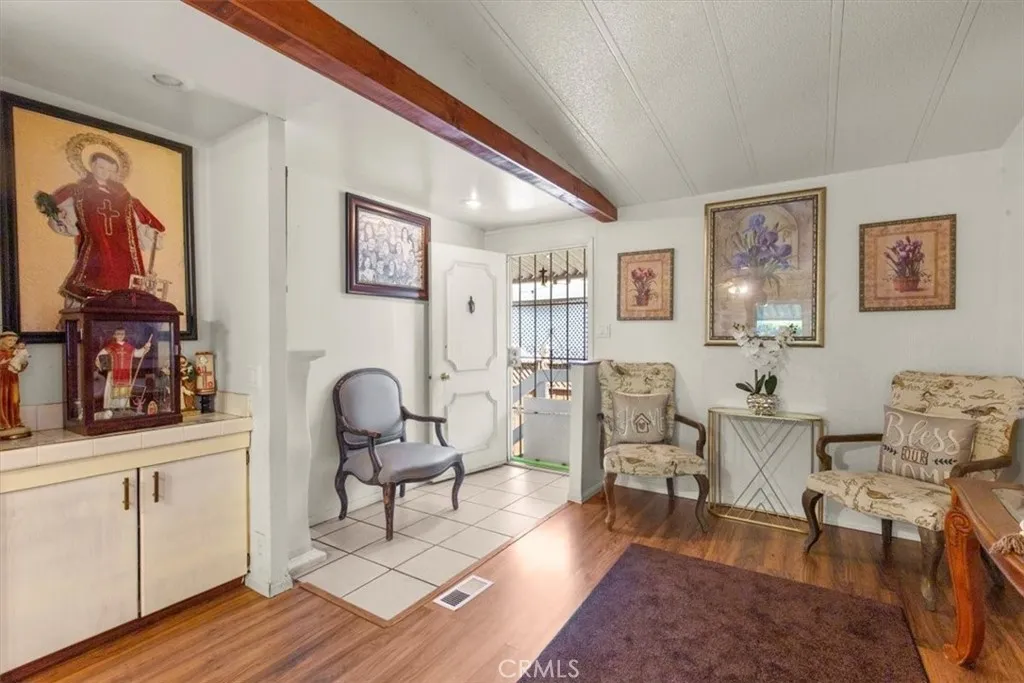 9080 Bloomfield Avenue, Unit 33 Cypress, CA 90630 - Photo 12 of 30 a living room with furniture and wooden floor