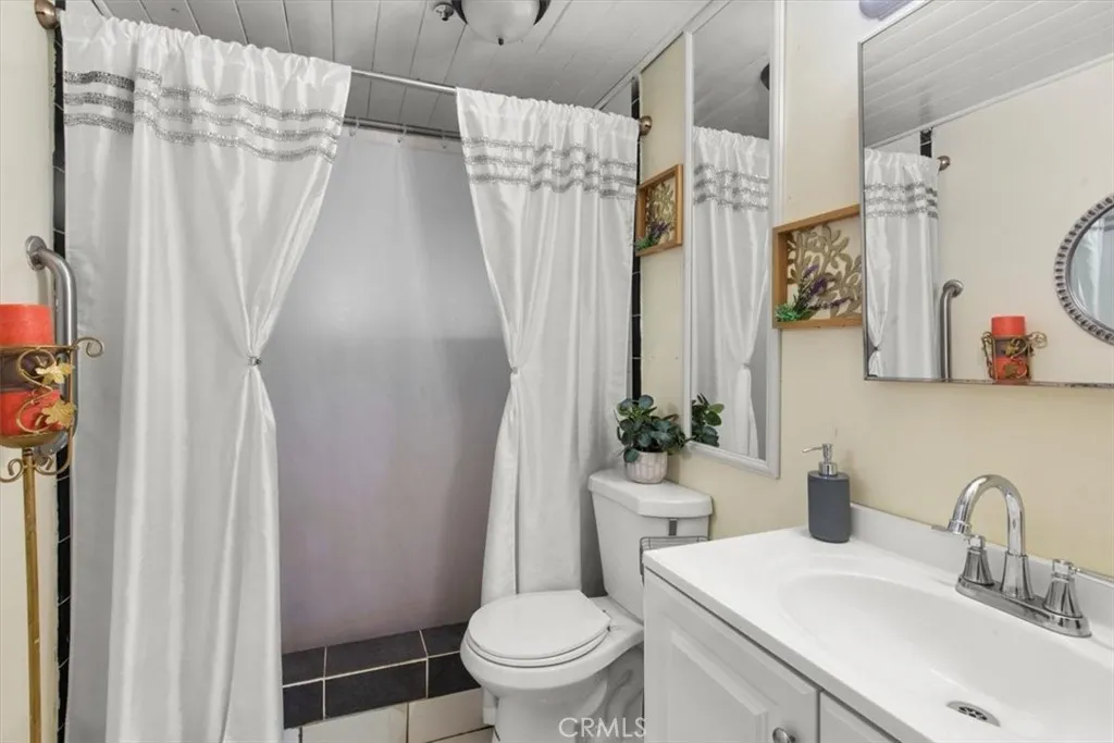 9080 Bloomfield Avenue, Unit 33 Cypress, CA 90630 - Photo 15 of 30 a bathroom with a sink toilet and shower