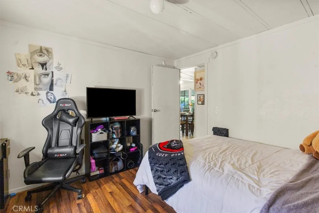 9080 Bloomfield Avenue, Unit 33 Cypress, CA 90630 - Photo 17 of 30 a bedroom with a bed and a flat screen tv
