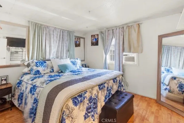 a bedroom with bed and a window