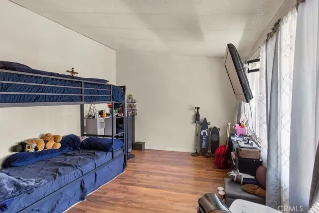 a living room with furniture a air conditioner and a window