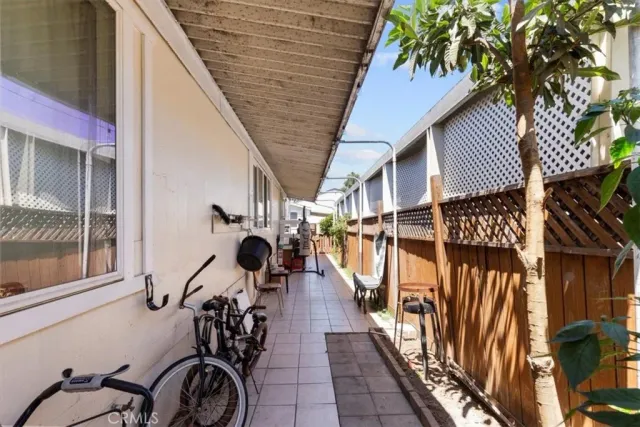 a view of a porch with wooden floor
