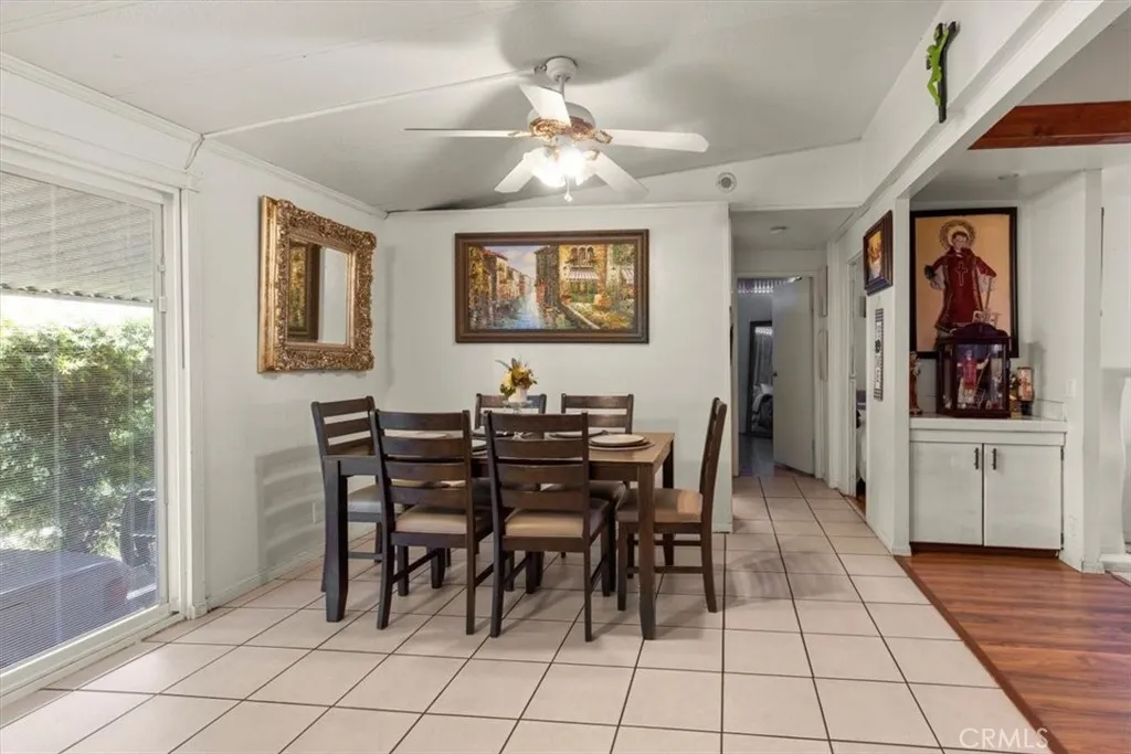 9080 Bloomfield Avenue, Unit 33 Cypress, CA 90630 - Photo 8 of 30 a view of a dining room with furniture and chandelier