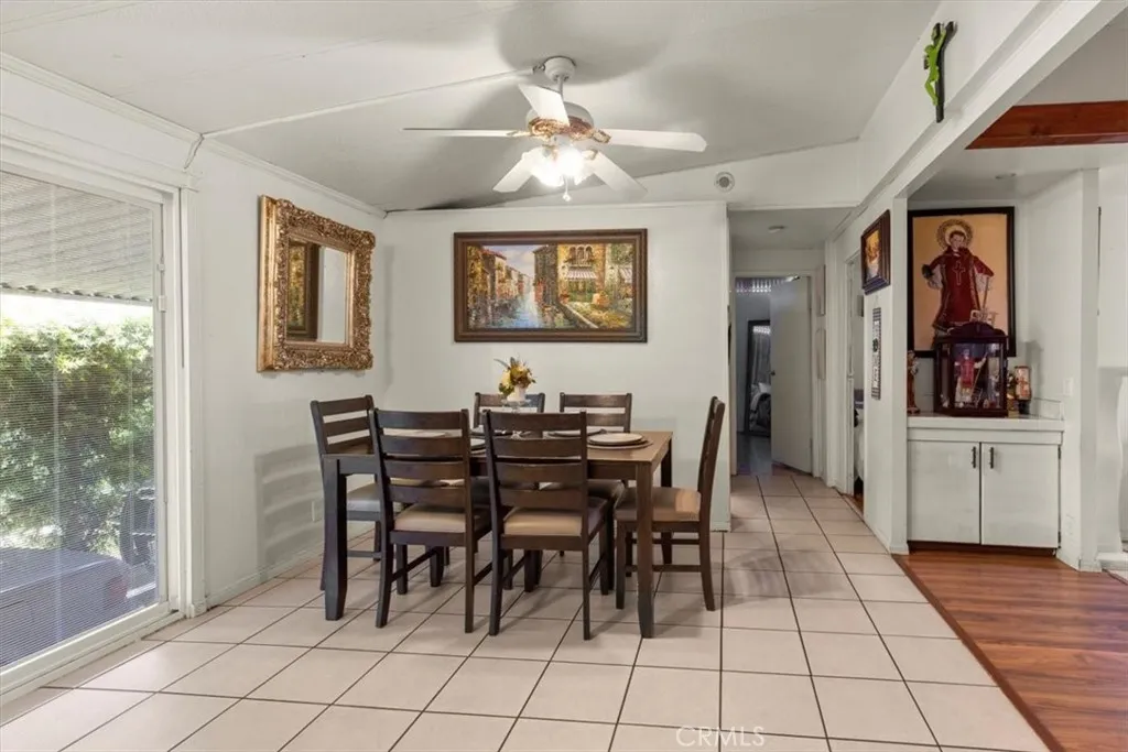 9080 Bloomfield Avenue, Unit 33 Cypress, CA 90630 - Photo 8 of 30 a view of a dining room with furniture and chandelier