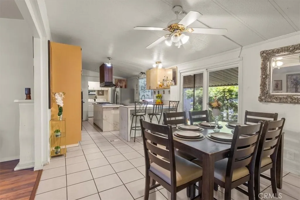 9080 Bloomfield Avenue, Unit 33 Cypress, CA 90630 - Photo 9 of 30 The dining and living room offer an open, inviting layout with abundant natural light, perfect for gatherings and everyday comfort.