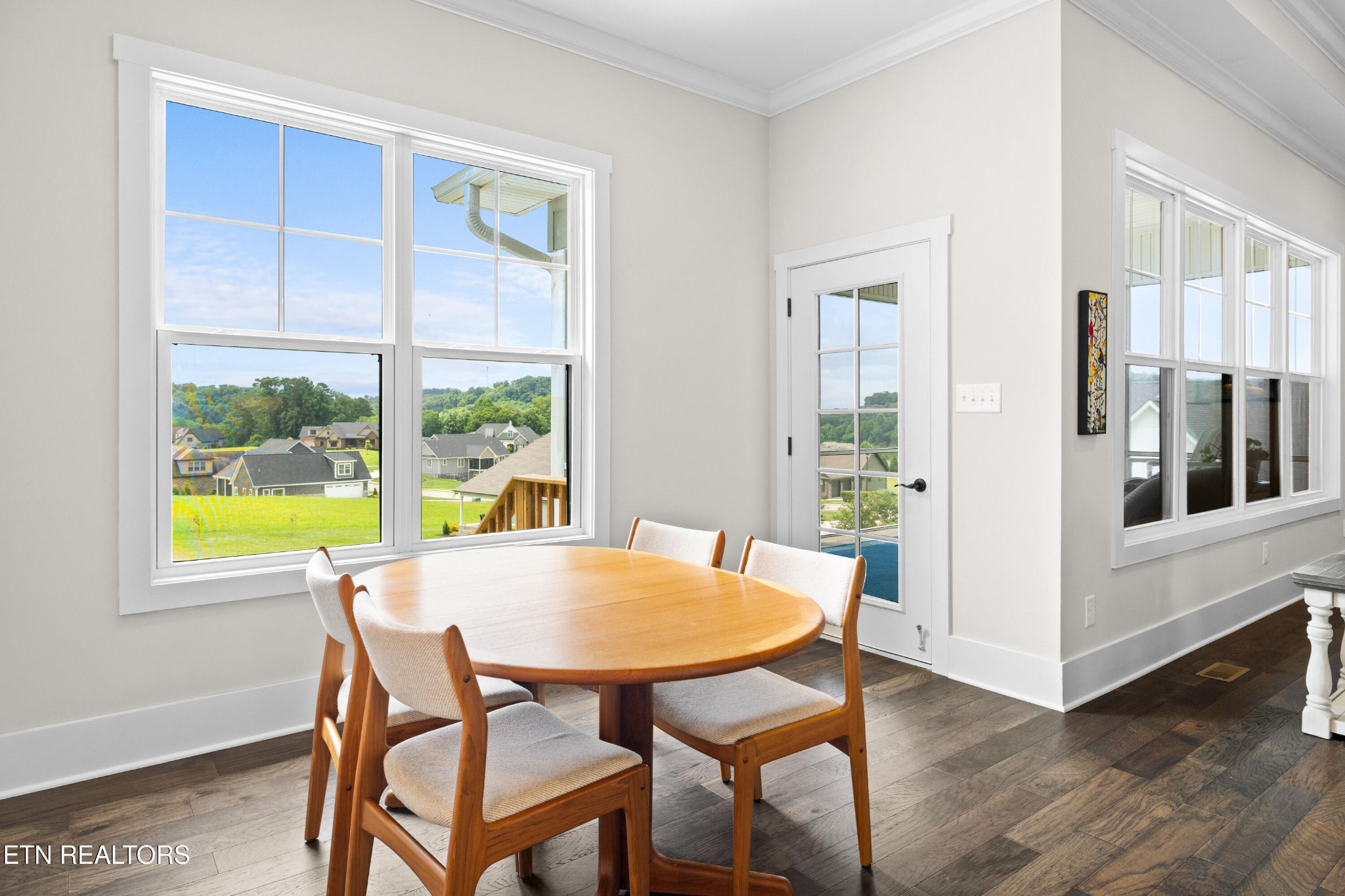 7791 Morganton Road Greenback, TN 37742 - Photo 22 of 53 a view of a dining room with furniture window and wooden floor