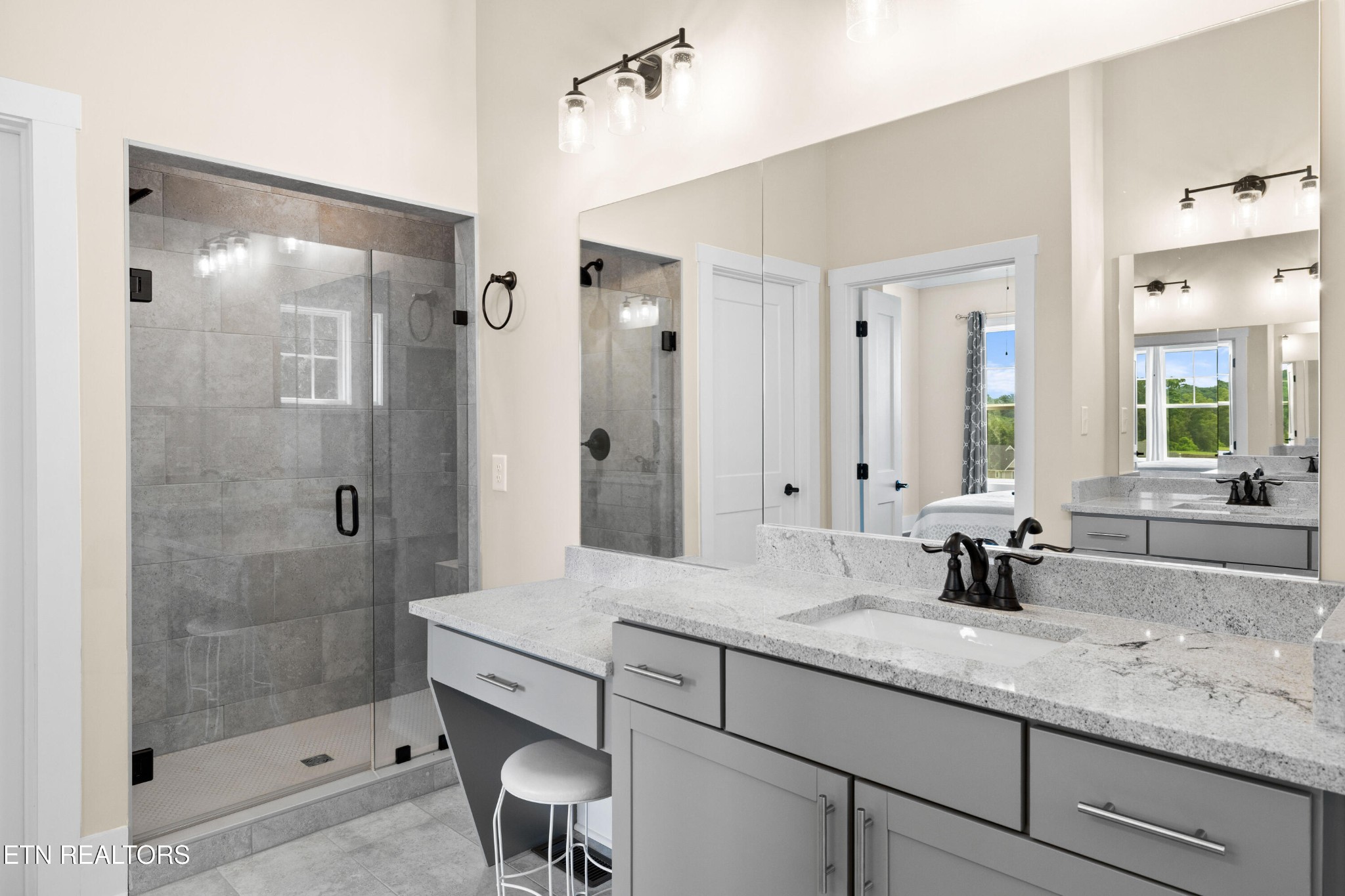 7791 Morganton Road Greenback, TN 37742 - Photo 34 of 53 a bathroom with a granite countertop sink mirror and double