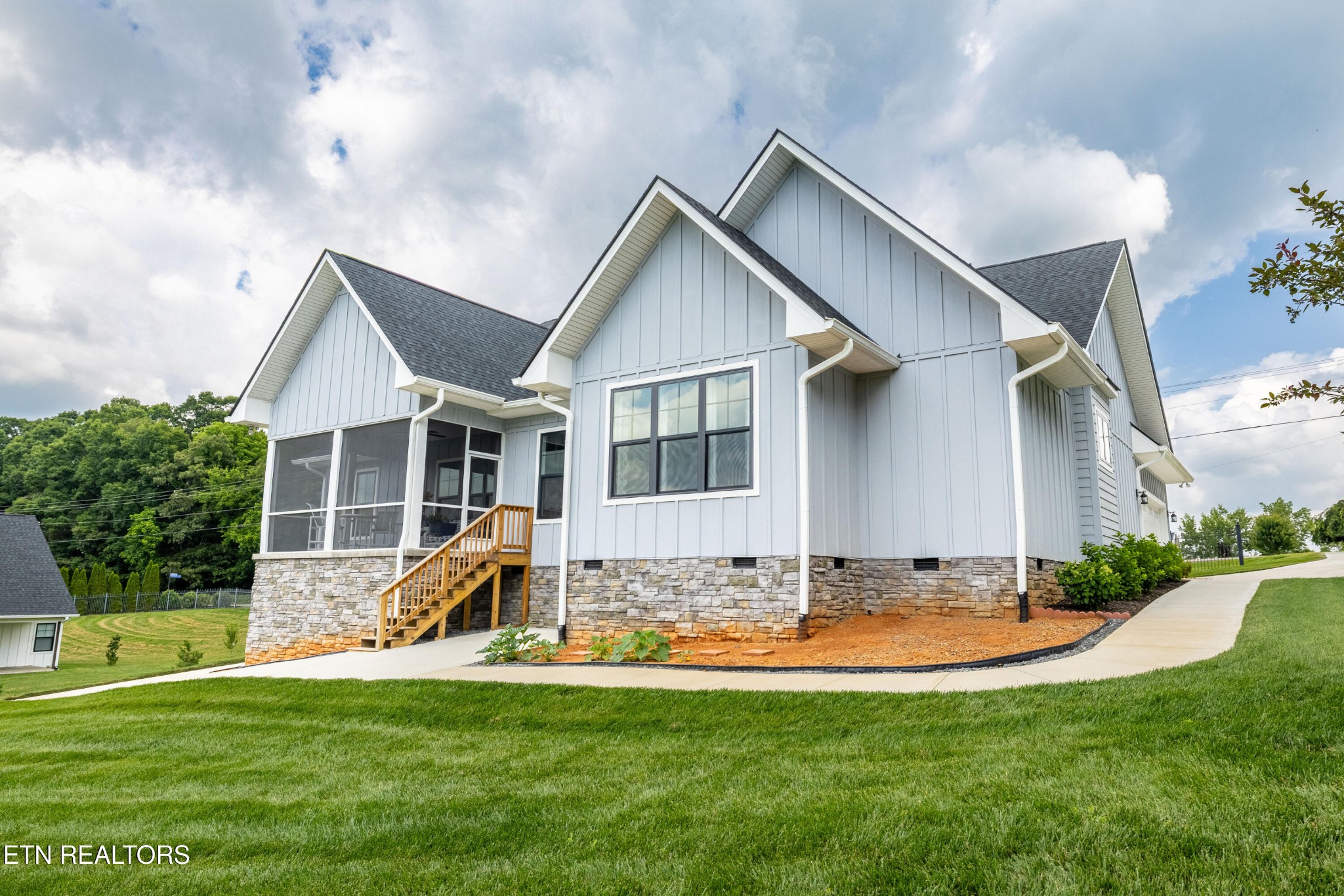 7791 Morganton Road Greenback, TN 37742 - Photo 4 of 53 a front view of house with yard and green space
