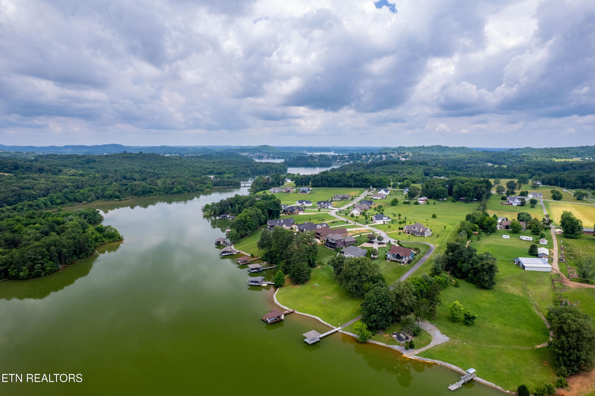 7791 Morganton Road Greenback, TN 37742 - Photo 5 of 53 a view of a lake with houses in back