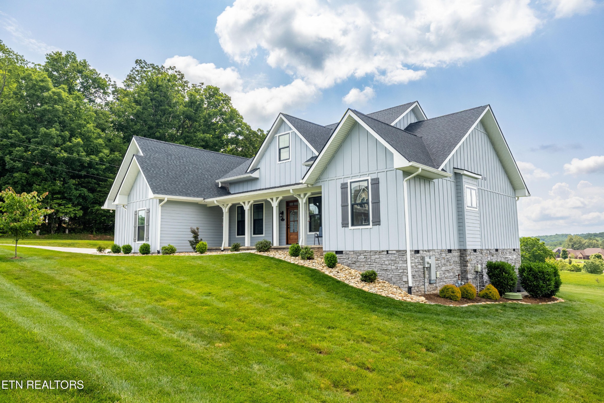 7791 Morganton Road Greenback, TN 37742 - Photo 53 of 53 a front view of a house with a garden and yard