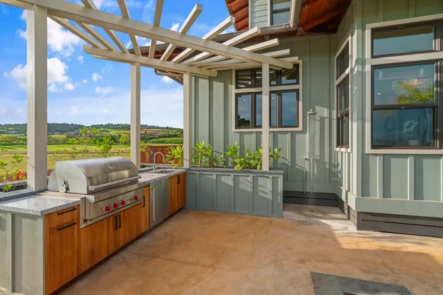 a kitchen with stainless steel appliances granite countertop a stove and cabinets