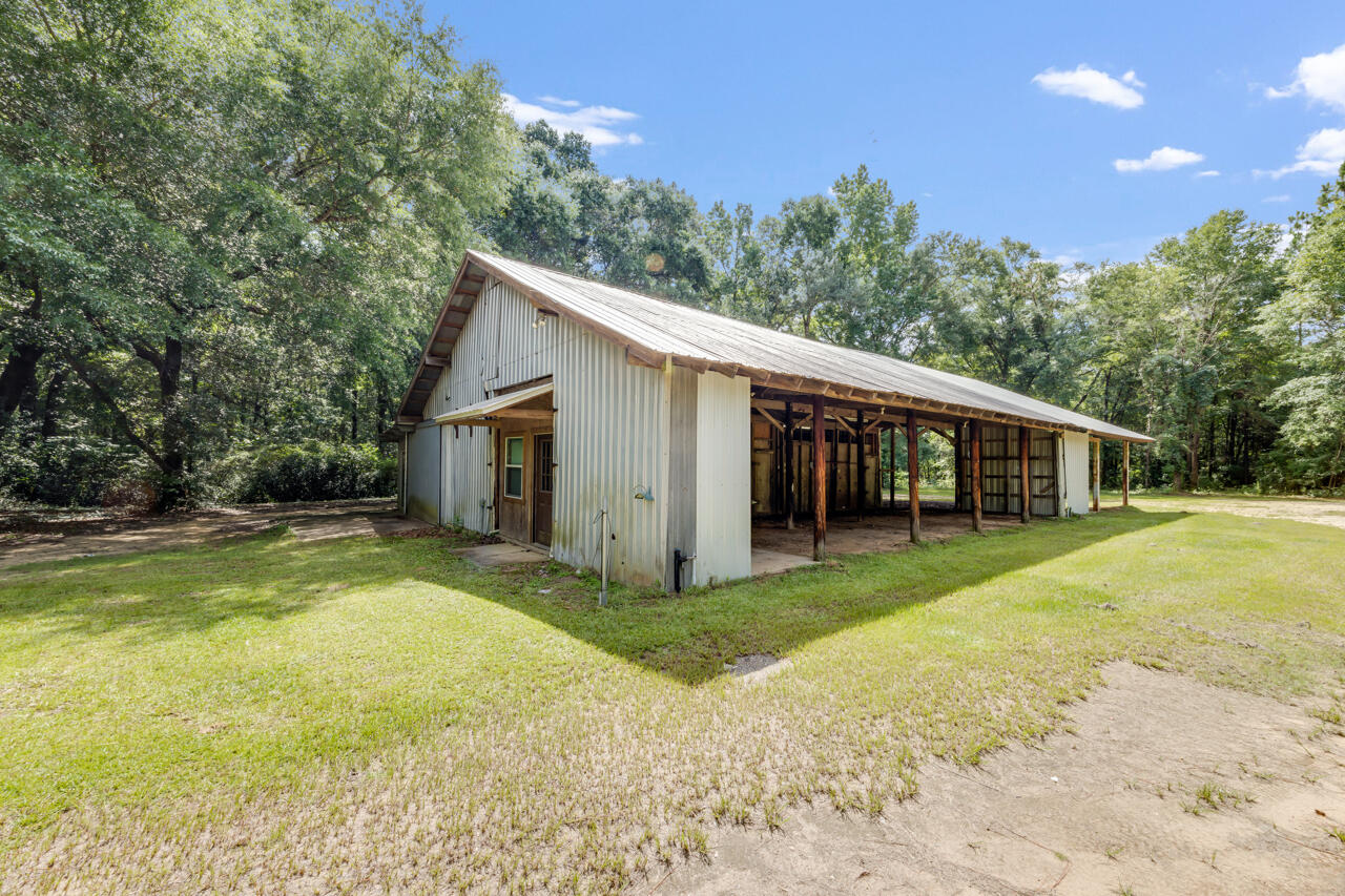 1318 John Riley Barnhill Road Baker, FL 32531 - Photo 13 of 40 a view of a house with a yard