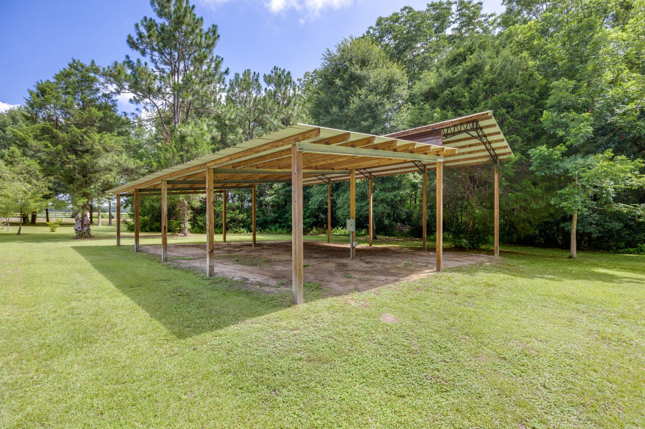 1318 John Riley Barnhill Road Baker, FL 32531 - Photo 15 of 40 a view of house with a backyard