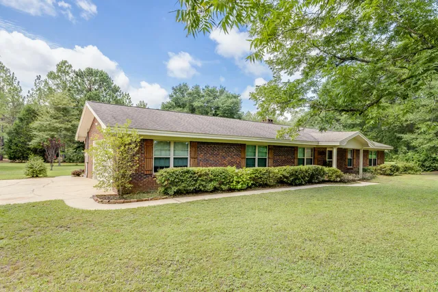 a view of a house with a garden