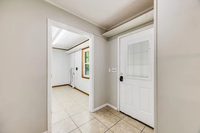 a view of a big room with closet and a chandelier fan