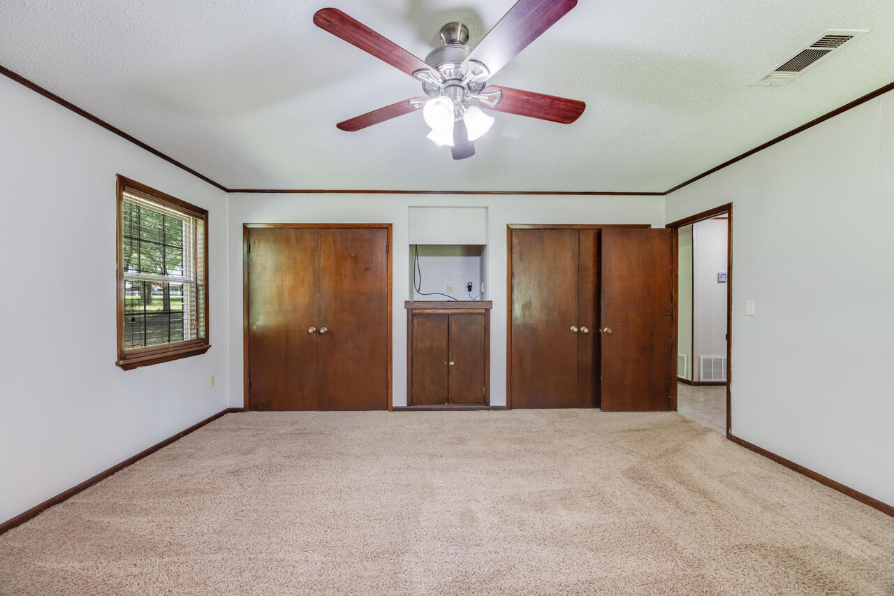 1318 John Riley Barnhill Road Baker, FL 32531 - Photo 30 of 40 a view of a livingroom with a ceiling fan and window