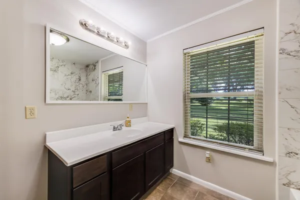 a bathroom with a toilet and a bathtub