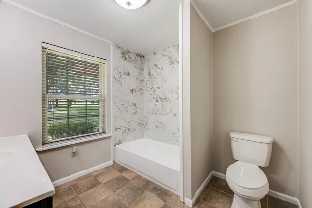 a view of a big room next to a yard