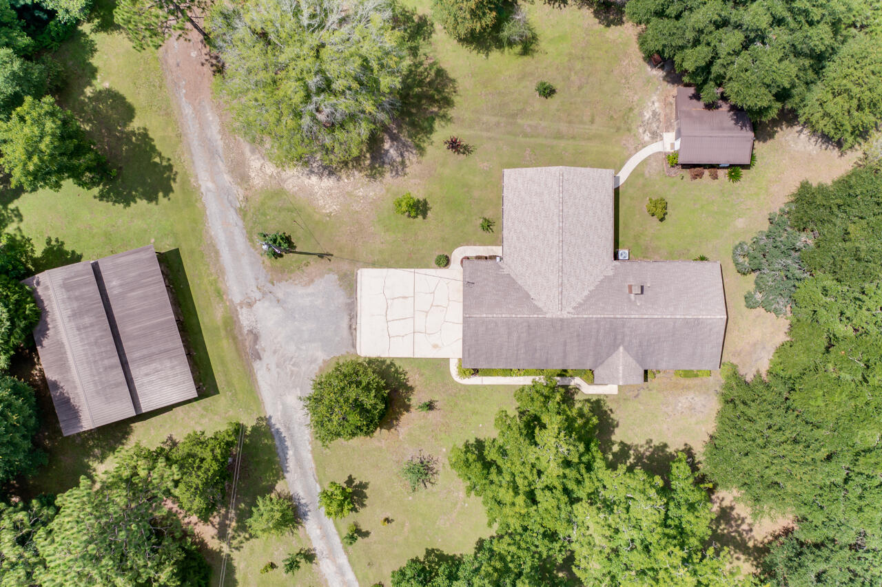 1318 John Riley Barnhill Road Baker, FL 32531 - Photo 6 of 40 an aerial view of a house with outdoor space and trees all around