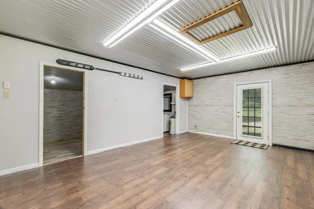 a view of a house with a backyard