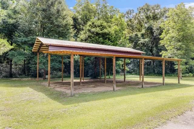 a backyard of a house with barbeque oven