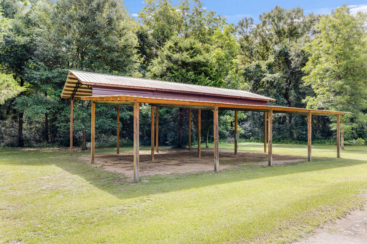 1318 John Riley Barnhill Road Baker, FL 32531 - Photo 9 of 40 a view of a house with a backyard