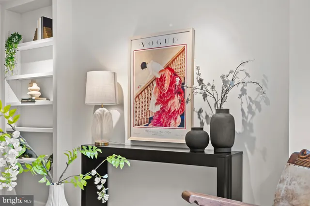 a view of a dining room with furniture and a potted plant