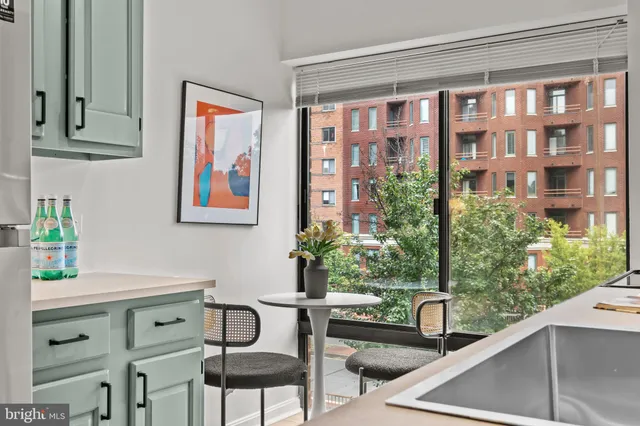 a view of a chairs and table in a balcony